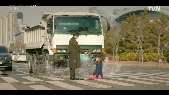 The character "Doom" offers his hand to the female lead offering to stop her from being hit by one of Korea's ubiquitous Trucks of Doom