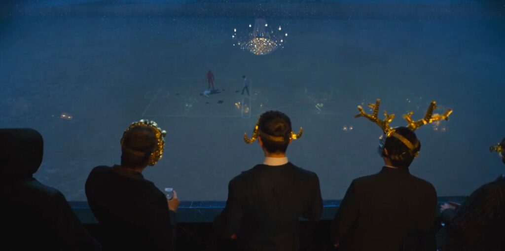 Men in masks watch the games from on high with expensive refreshments