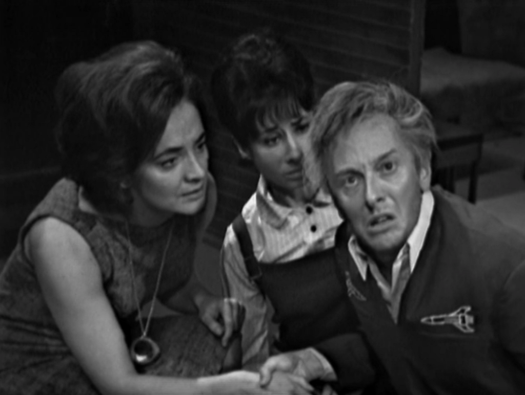 Barbara and Susan look concerned at a deranged John