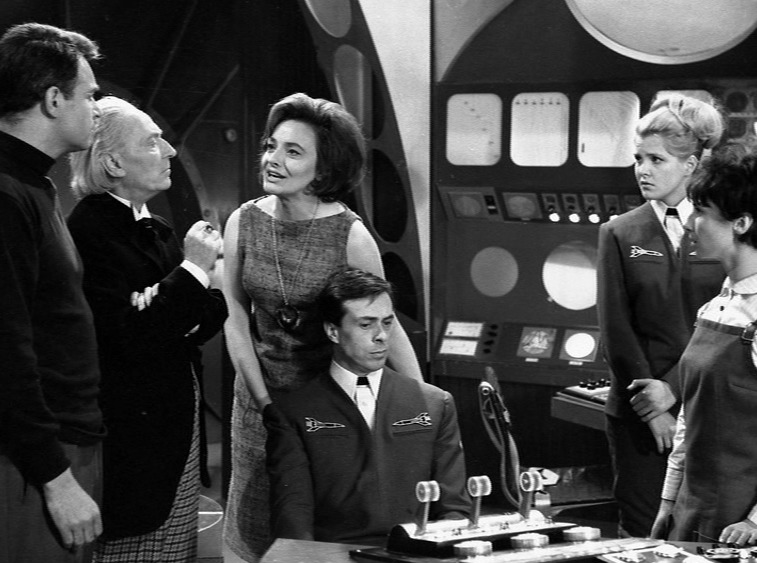 The TARDIS crew and the crew of the spaceship at the controls having an argument over the situation 