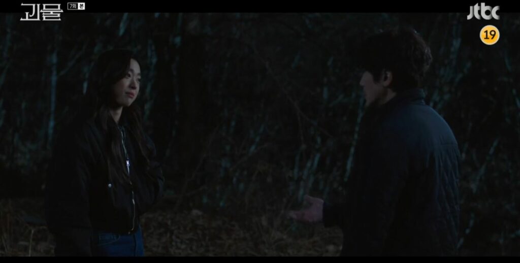 Jae-yi confronts Dong-shik in the woods while they're both seeking answers
