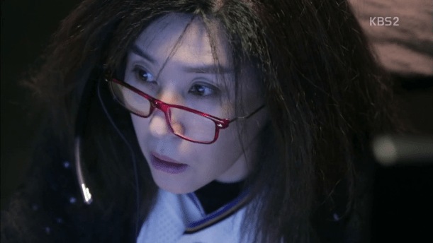 Healer's kickass Hacker Ahjumma; a middle aged woman with glasses and wild hair
