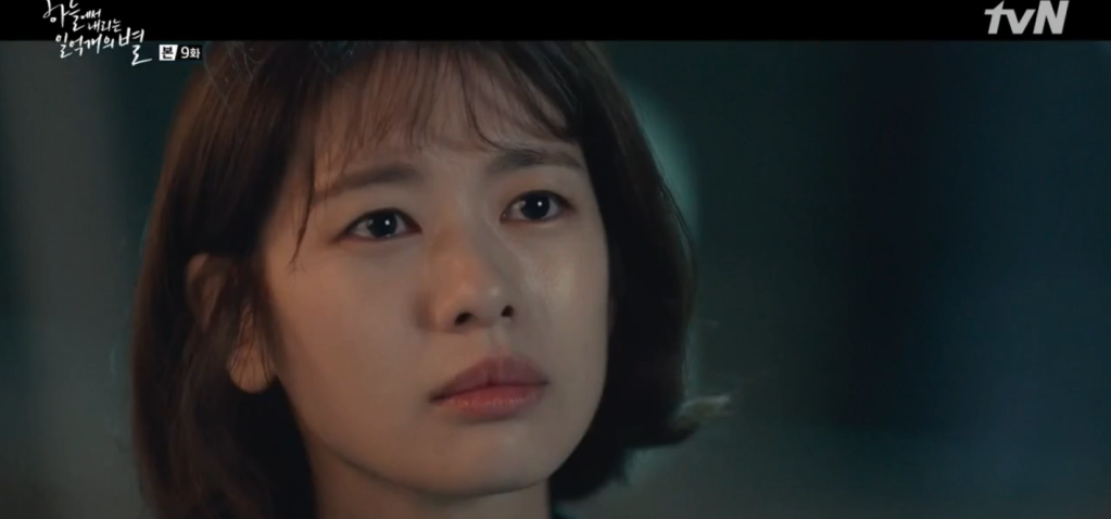 A close up shot of Jung So-min as
Yoo Jin-kang looking as though she's about to cry